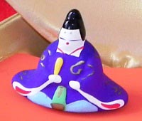 A miniature odairi-sama in the clam shell